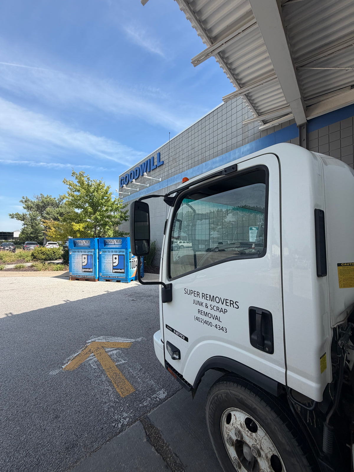The Super Removers truck parked outside Goodwill during a donation drop-off.